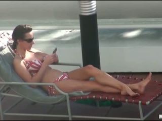 Busty chick is spied on while sunbathing