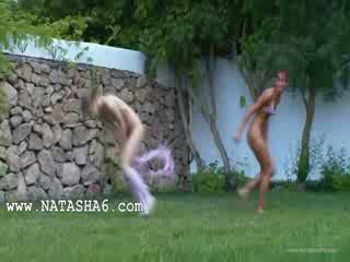 Russian chicks watersports in the grass